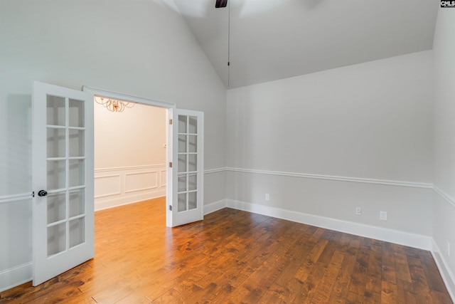 unfurnished room featuring french doors, ceiling fan, high vaulted ceiling, and hardwood / wood-style floors