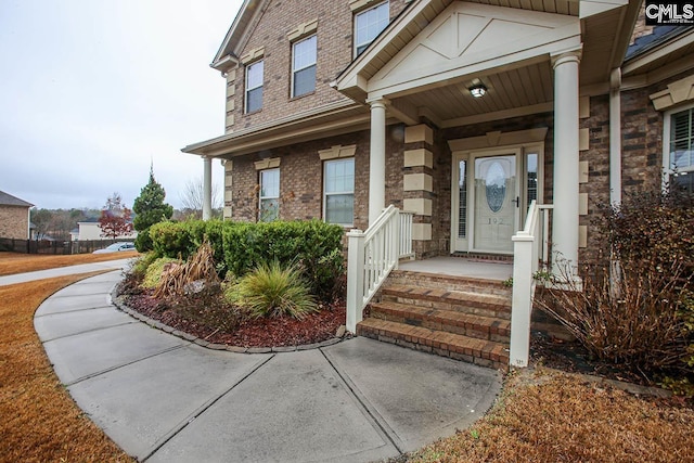 entrance to property featuring covered porch