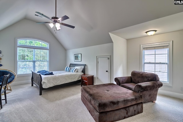 carpeted bedroom with ceiling fan and vaulted ceiling