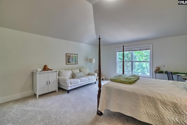 carpeted bedroom featuring vaulted ceiling