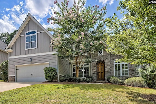 view of front of home with a garage and a front lawn