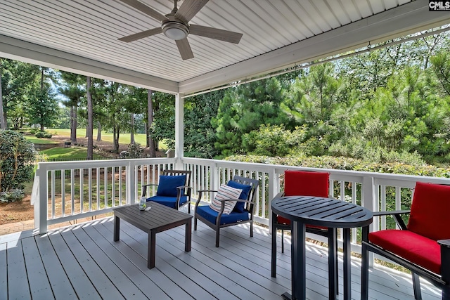 wooden deck featuring ceiling fan