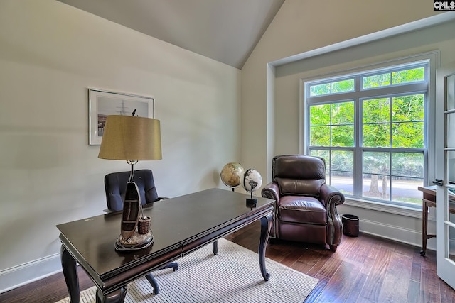 office space with vaulted ceiling and dark wood-type flooring