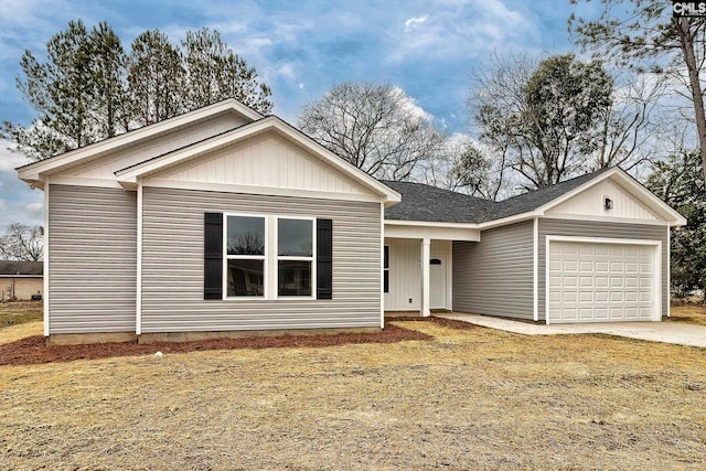 view of front of home with a garage and a front yard