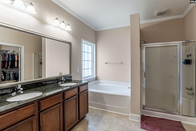 bathroom featuring plus walk in shower, vanity, and crown molding