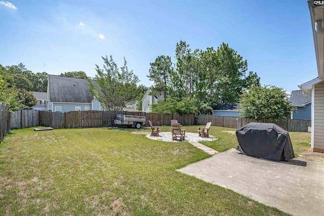 view of yard with a patio area and an outdoor fire pit