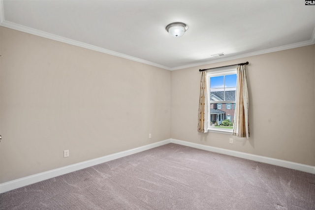 empty room with crown molding and carpet floors