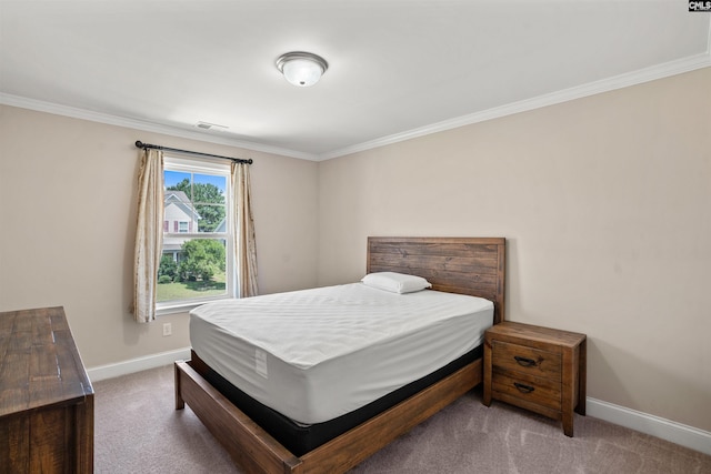 bedroom featuring crown molding and carpet flooring