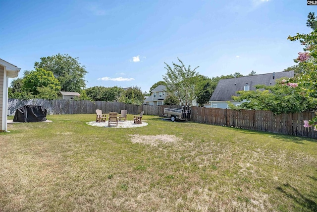 view of yard with a patio area and an outdoor fire pit