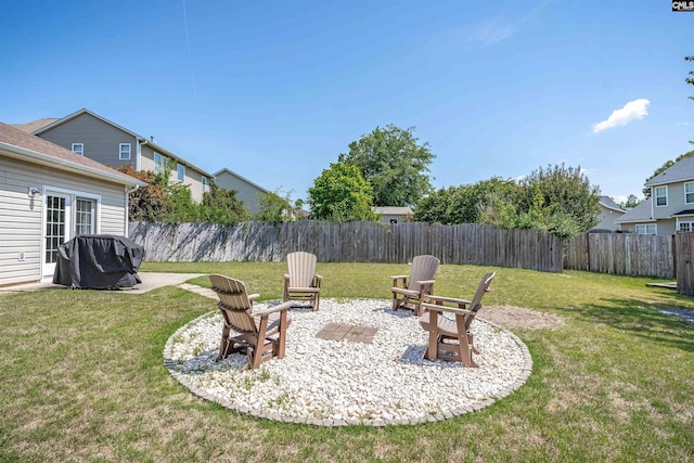 view of yard featuring an outdoor fire pit and a patio area