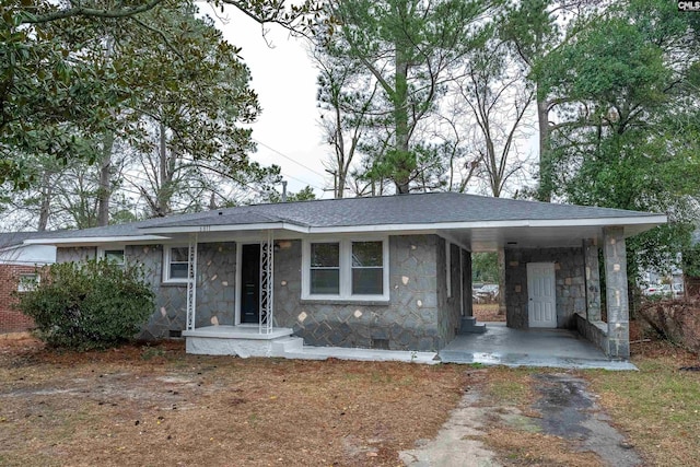 ranch-style home featuring a carport