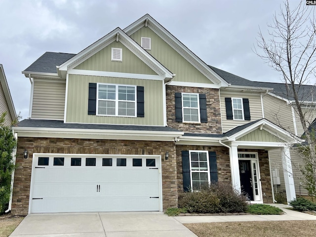 craftsman house with a garage