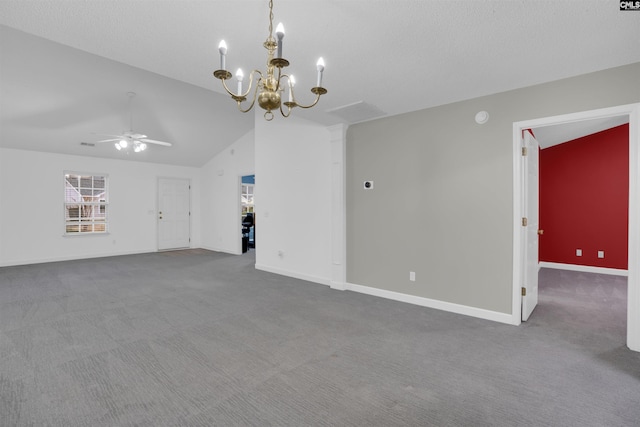 unfurnished living room with vaulted ceiling, carpet, ceiling fan with notable chandelier, and a textured ceiling