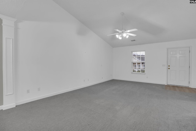 interior space featuring ceiling fan, vaulted ceiling, and ornate columns