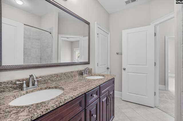 bathroom with vanity and tile patterned floors