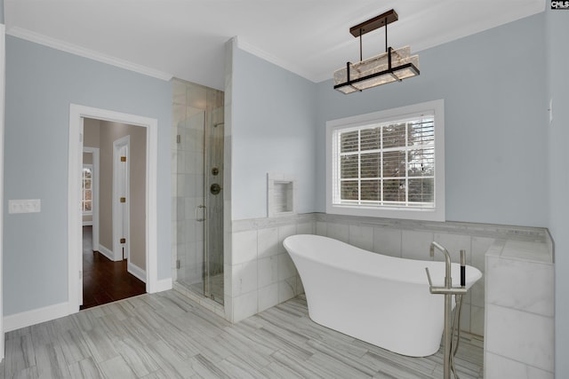 bathroom with ornamental molding, separate shower and tub, and tile walls