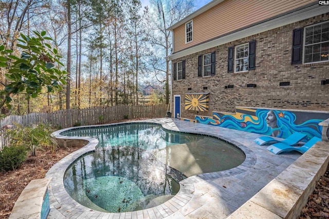 view of swimming pool featuring an in ground hot tub