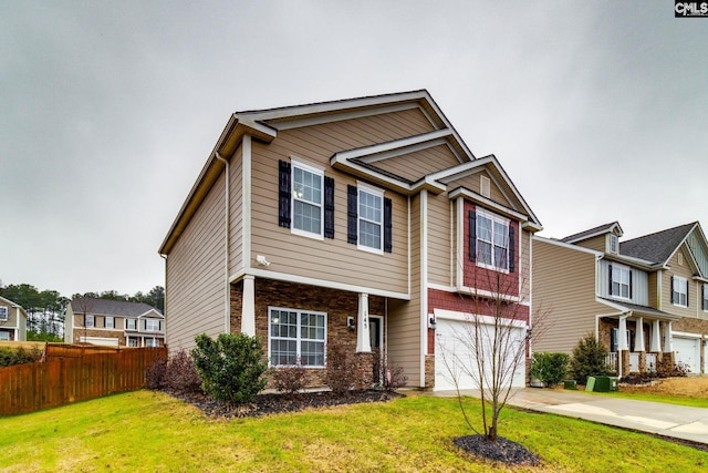 craftsman inspired home featuring a garage and a front yard