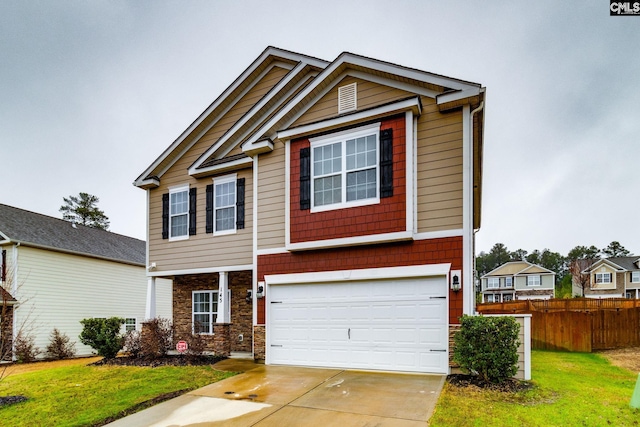 craftsman inspired home with a garage and a front yard