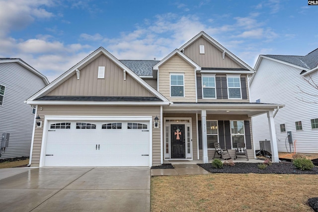 craftsman-style house featuring a garage, a front lawn, and a porch