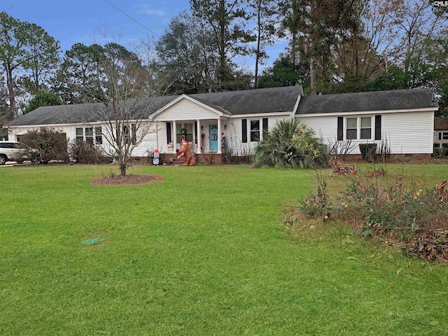 ranch-style house with a front yard and covered porch