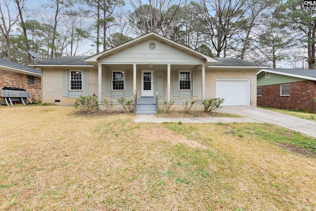 ranch-style home featuring a garage, covered porch, and a front yard