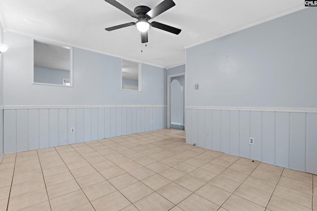 empty room with crown molding and ceiling fan