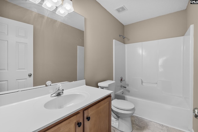 full bathroom with vanity, washtub / shower combination, and toilet