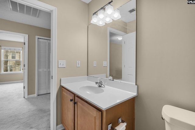 bathroom with vanity and toilet