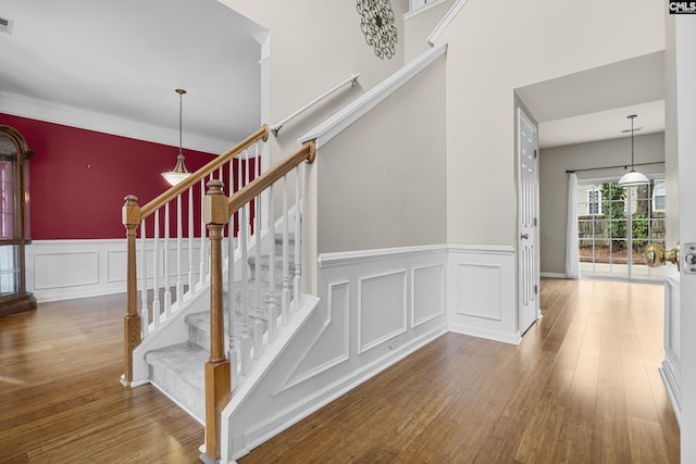 staircase featuring hardwood / wood-style floors