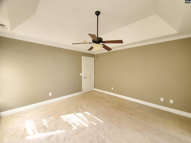 carpeted spare room with ornamental molding and ceiling fan