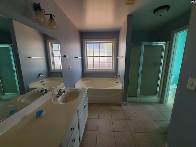 bathroom featuring tile patterned flooring, vanity, and independent shower and bath