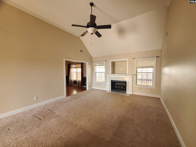 unfurnished living room featuring ceiling fan, dark carpet, and high vaulted ceiling