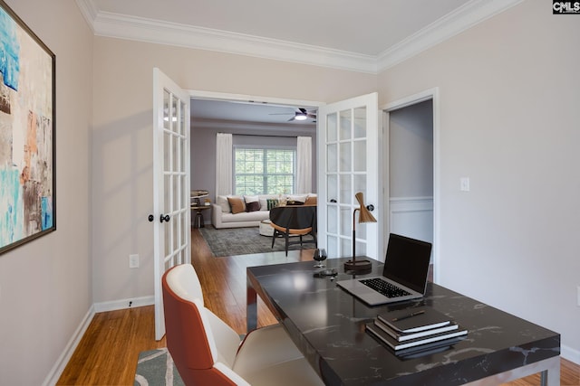 office featuring dark hardwood / wood-style flooring, crown molding, french doors, and ceiling fan