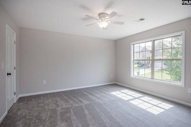 carpeted empty room featuring ceiling fan