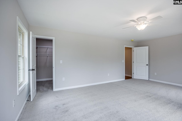 spare room featuring carpet flooring and ceiling fan