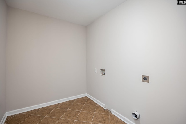 laundry room featuring tile patterned flooring, hookup for a washing machine, hookup for an electric dryer, and gas dryer hookup