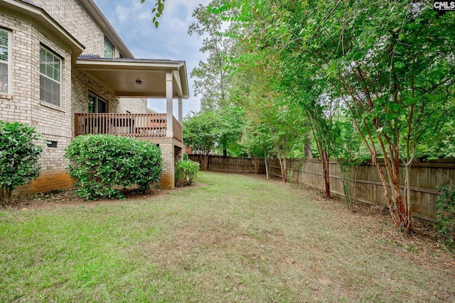 view of yard with a deck