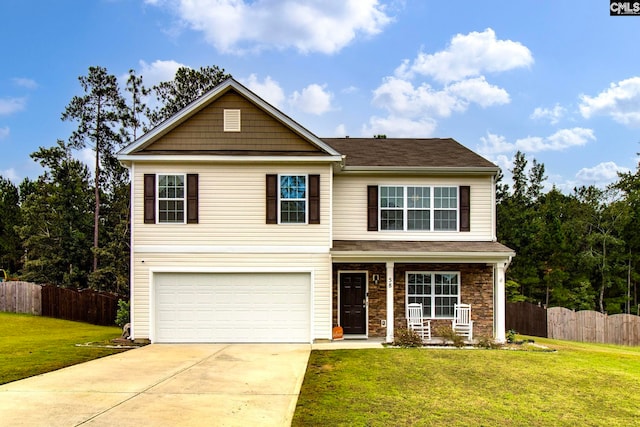 view of front of home with a porch, a garage, and a front yard