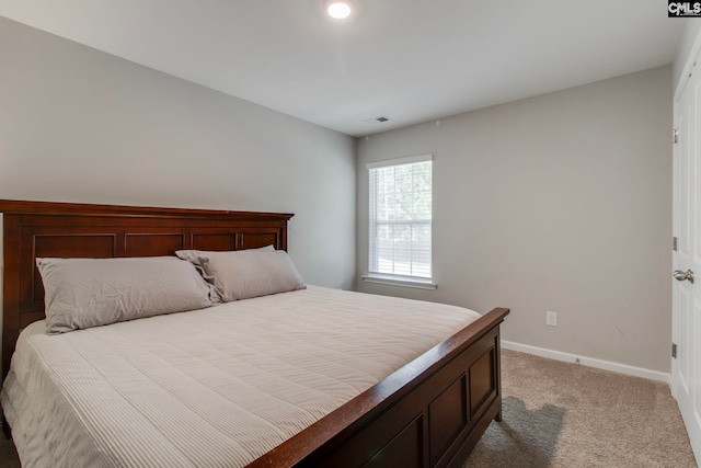 bedroom with light colored carpet