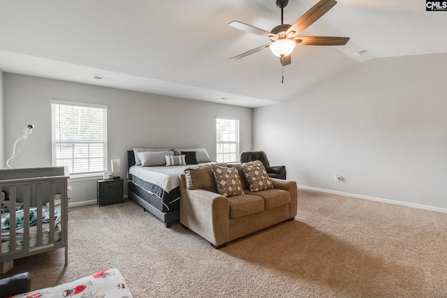 carpeted bedroom featuring lofted ceiling and ceiling fan