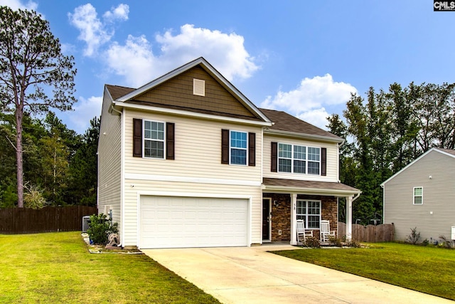 view of front of house with a garage and a front yard