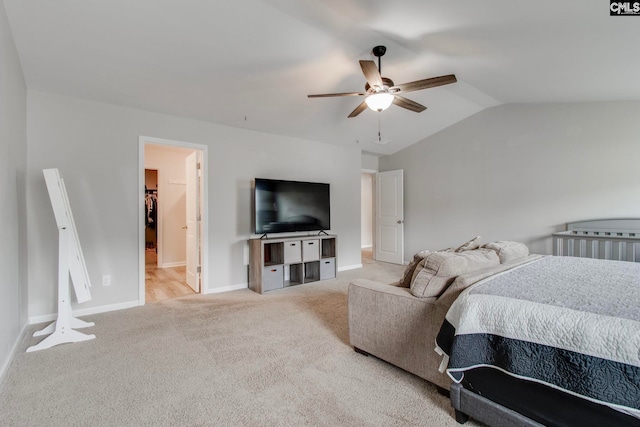 carpeted bedroom with lofted ceiling and ceiling fan