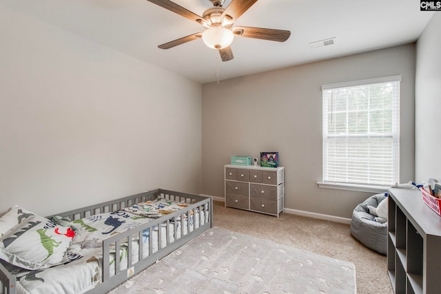 carpeted bedroom featuring ceiling fan