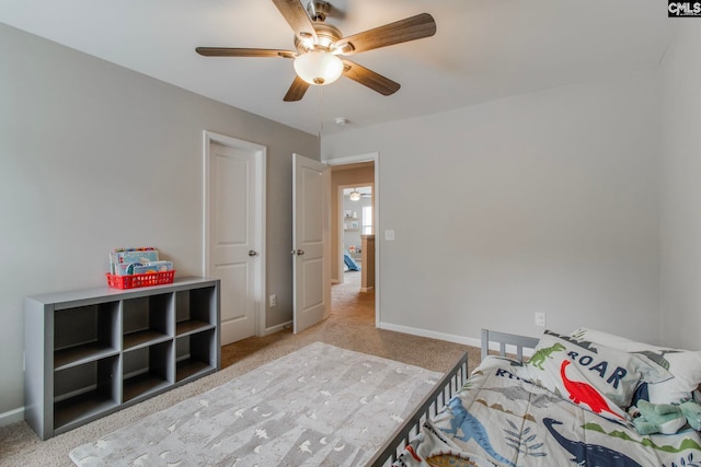 carpeted bedroom featuring ceiling fan