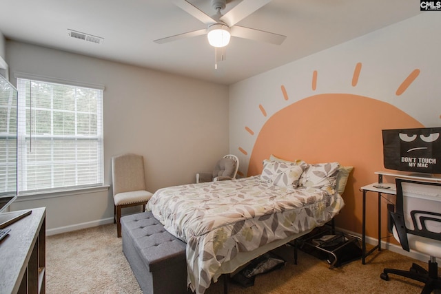 bedroom featuring light carpet and ceiling fan