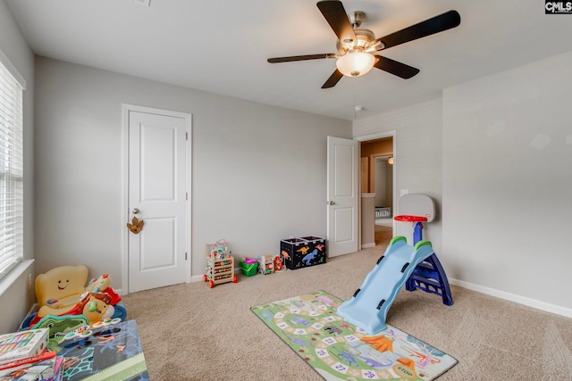 rec room featuring ceiling fan and carpet flooring