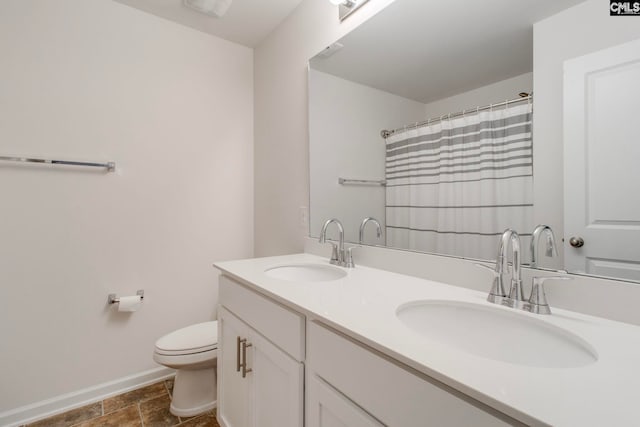 bathroom with vanity, toilet, and a shower with shower curtain