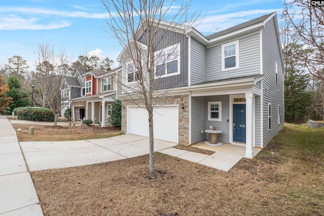 view of front of property featuring a garage and a front lawn