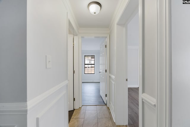 hall featuring ornamental molding and light wood-type flooring